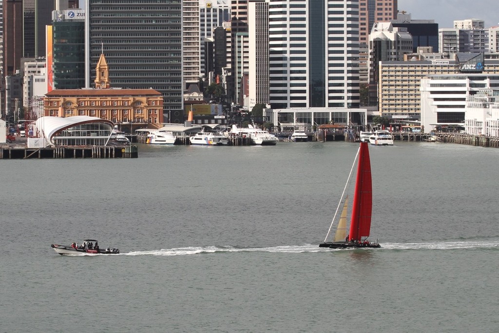 Passing downtown - Emirates Team NZ under tow - Wingsail test - 3 November 2011 © Richard Gladwell www.photosport.co.nz